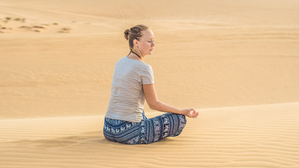 Yoga session in the desert of Merzouga-Morocco