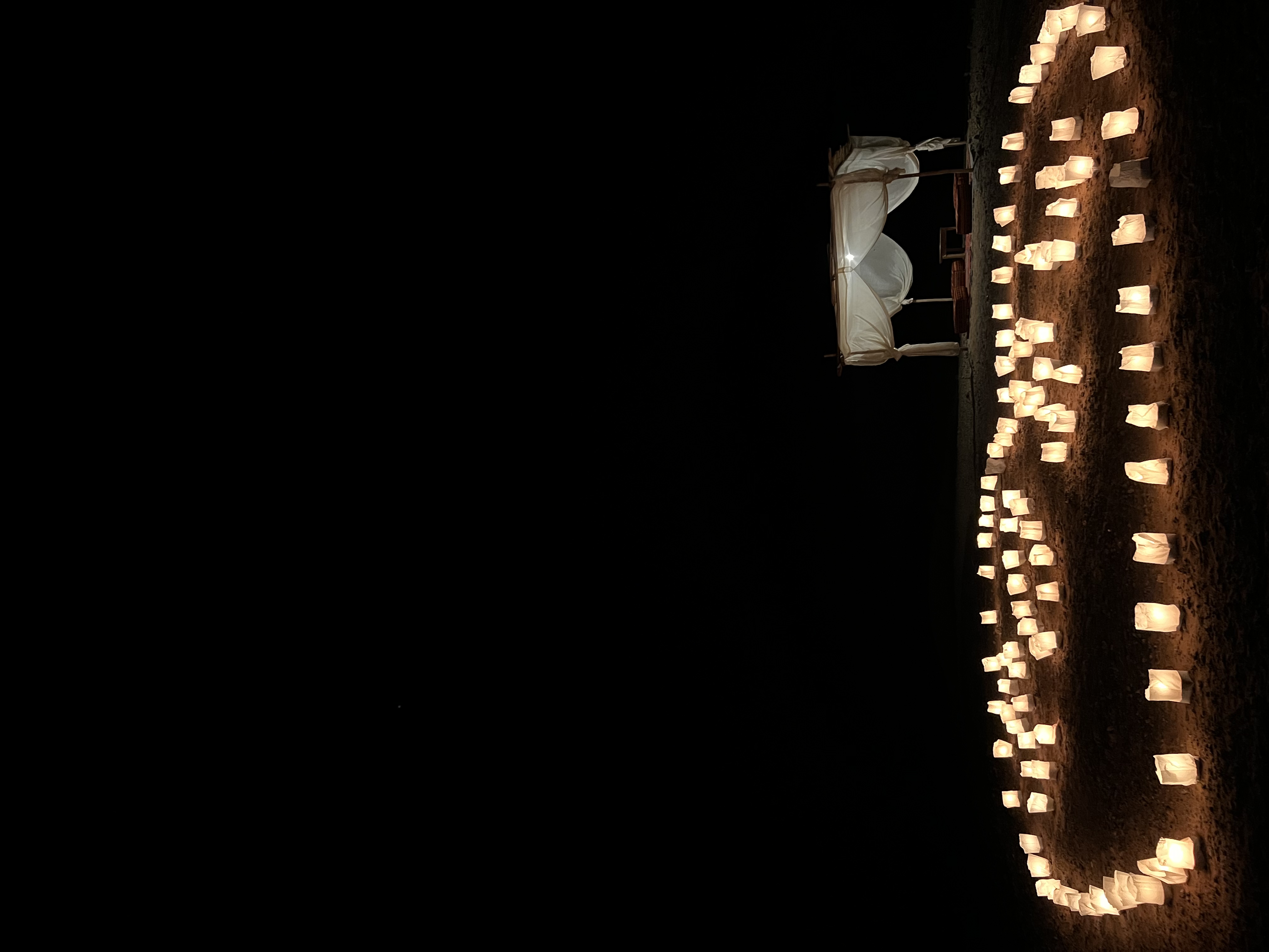 Sahara Royal Resort — camp exterior at golden hour, Merzouga