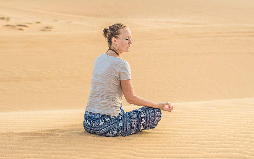 Yoga session in the desert of Merzouga-Morocco